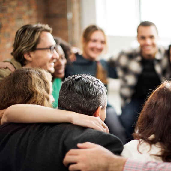 Community team doing a group hug